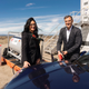A photo of Michael Steiner and Barbara Frenkel filling a Porsche 911 with gas.